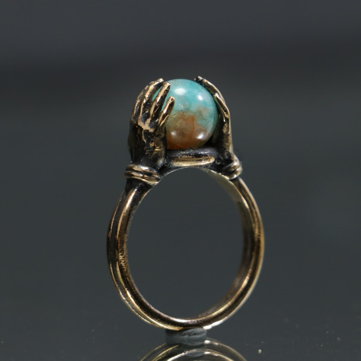 Jade Stone Ring Between Hands