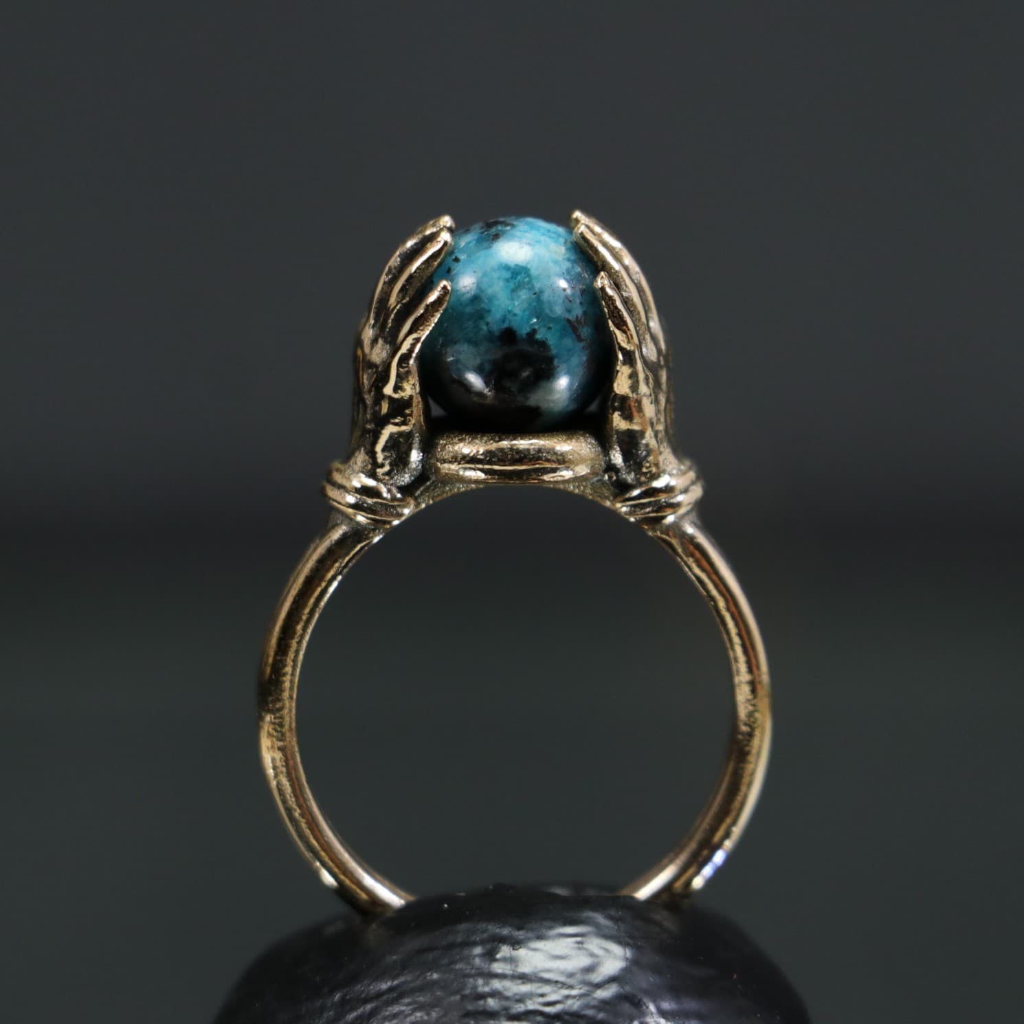 Turquoise Stone Ring Between Hands