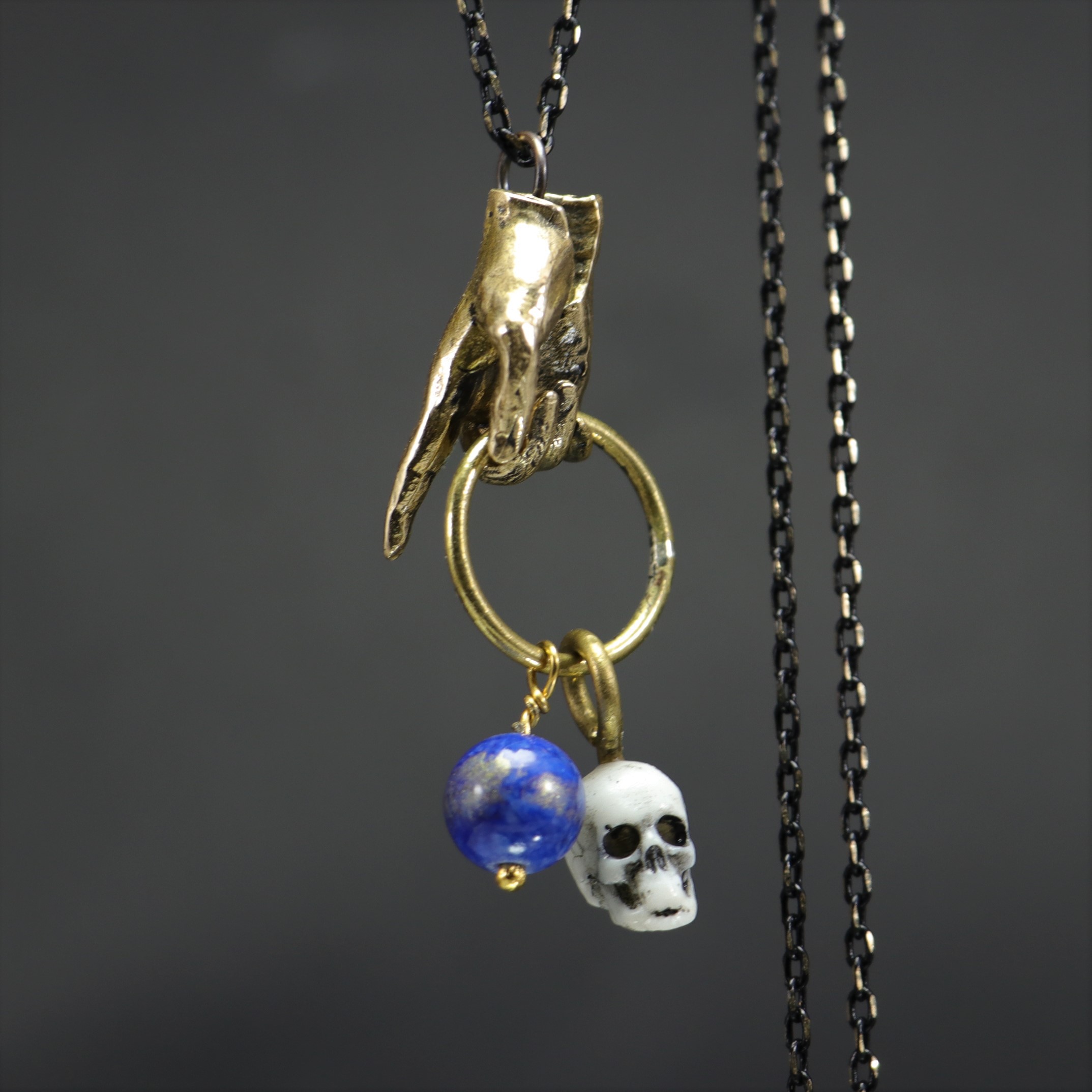 Hand and Skull Lapis Stone Necklace