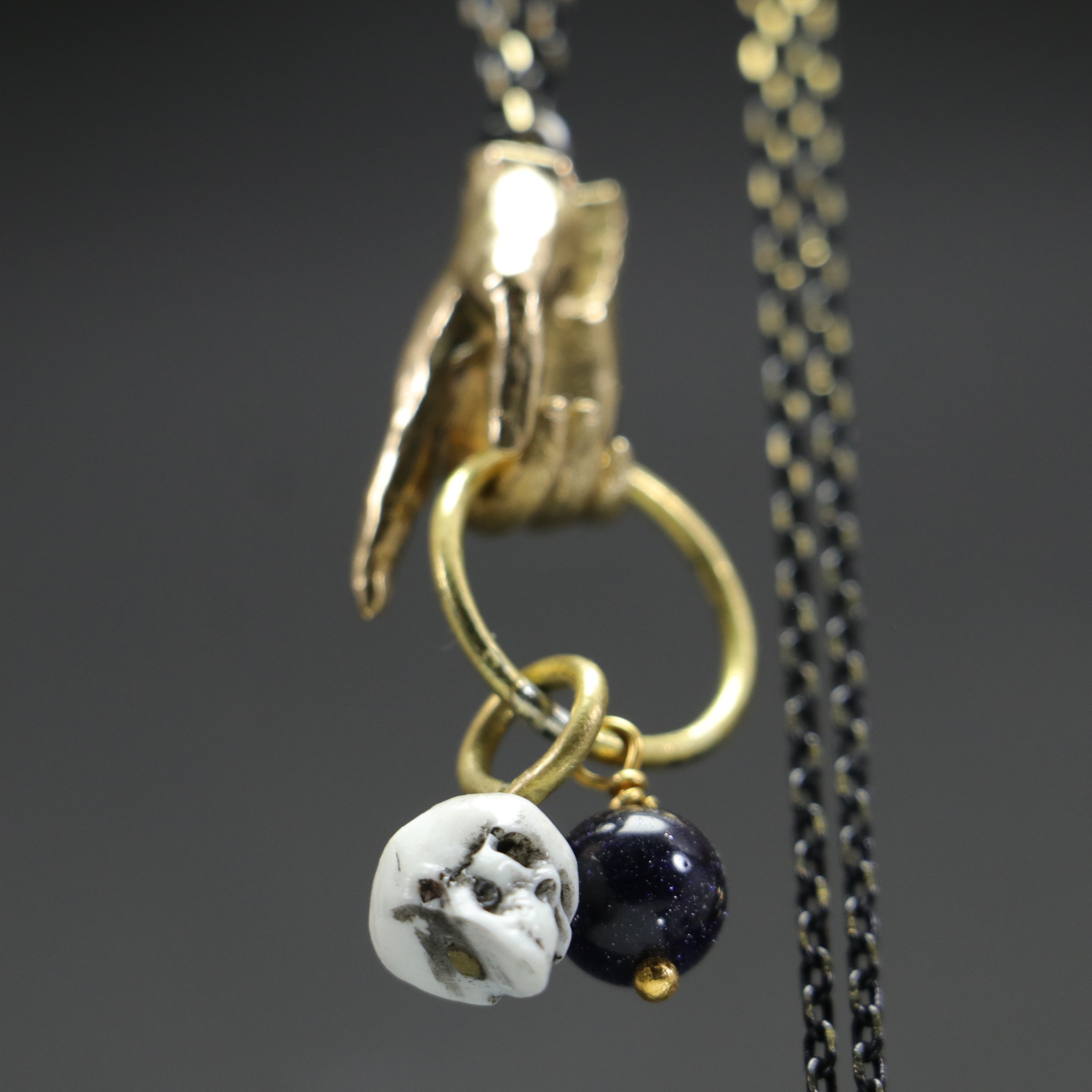 Hand and Skull Star Stone Necklace