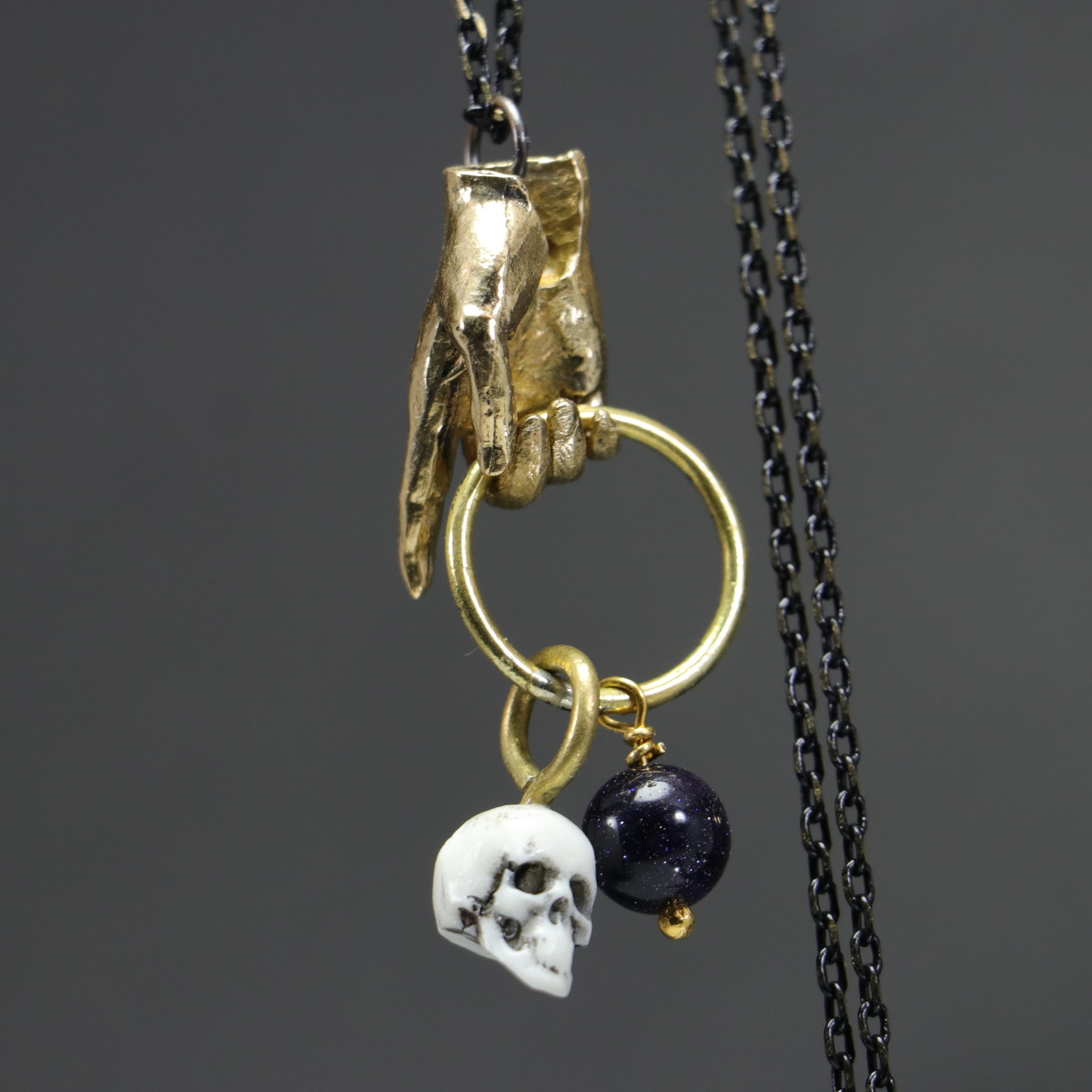 Hand and Skull Star Stone Necklace